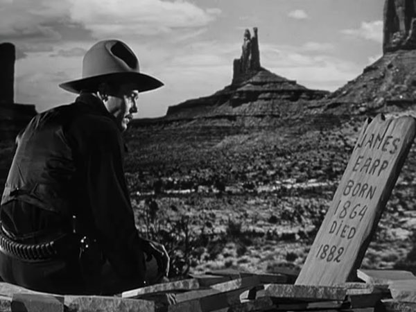 Wyatt Earp at the grave of James Earp