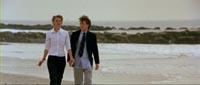 Sookie and Igby walking on the beach