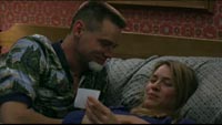 Charlie showing a photo to Irene